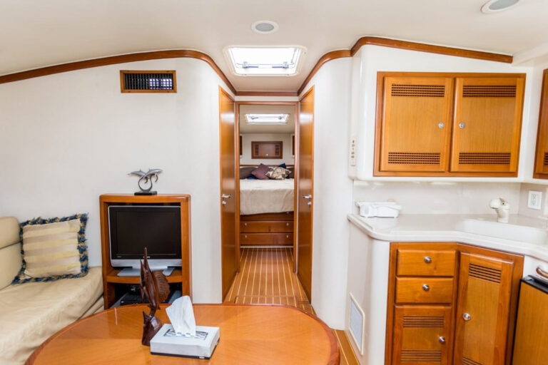 Wood-trimmed salon and galley of the 45' Cabo flybridge
