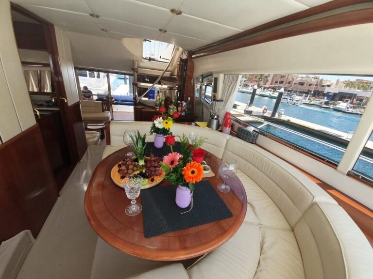 Dining table with flowers in the salon of the 70' Viking Princess